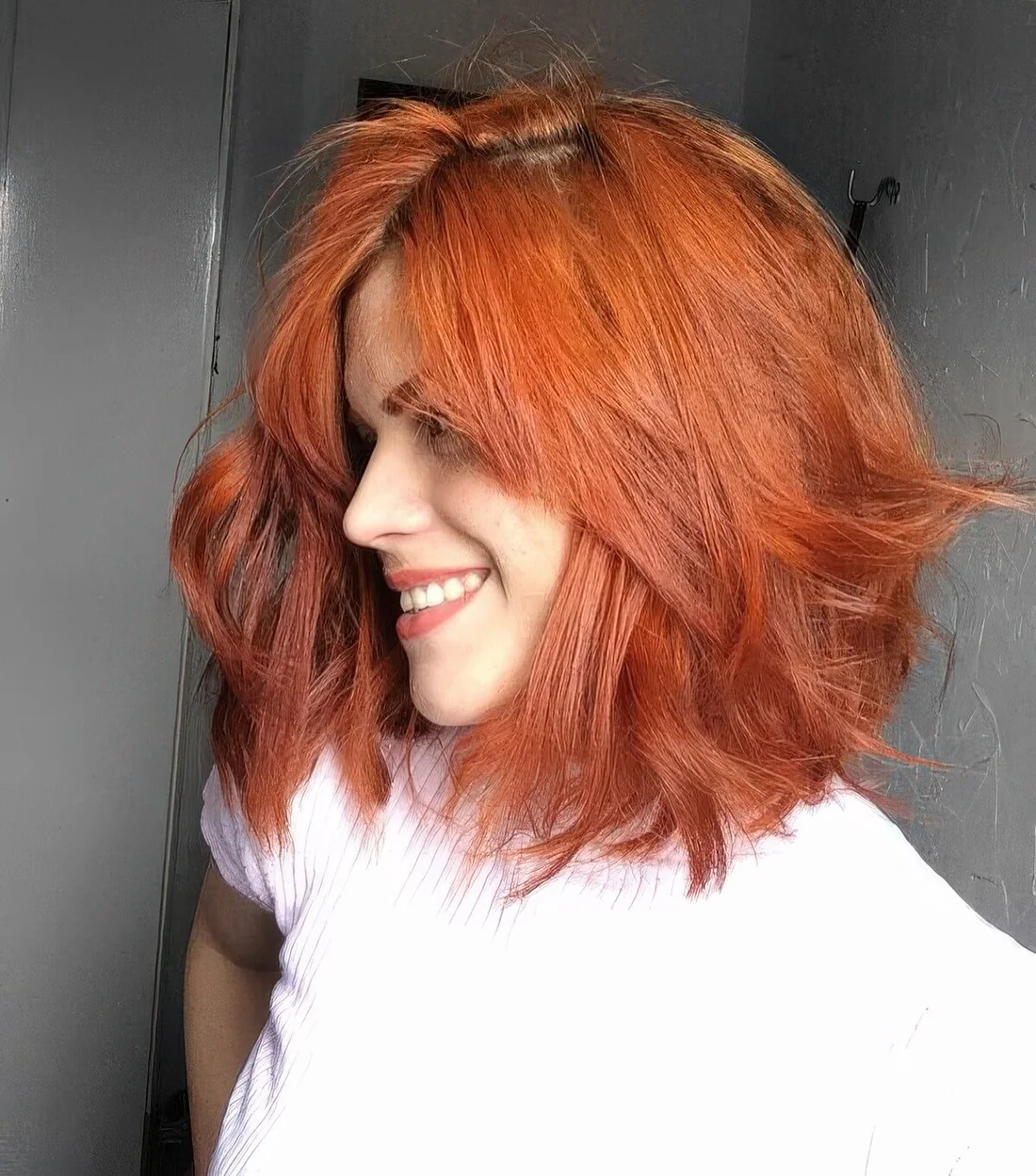 Red shaggy long bob with a bit of waves and a lot of dimension.