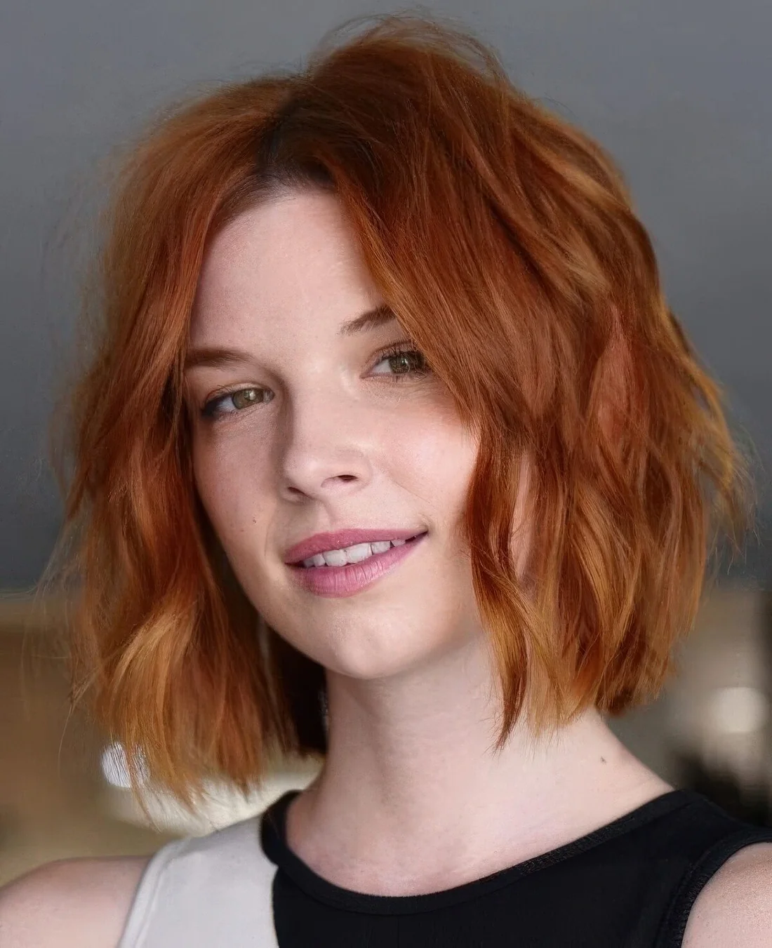 Ginger red wavy long bob with volume.