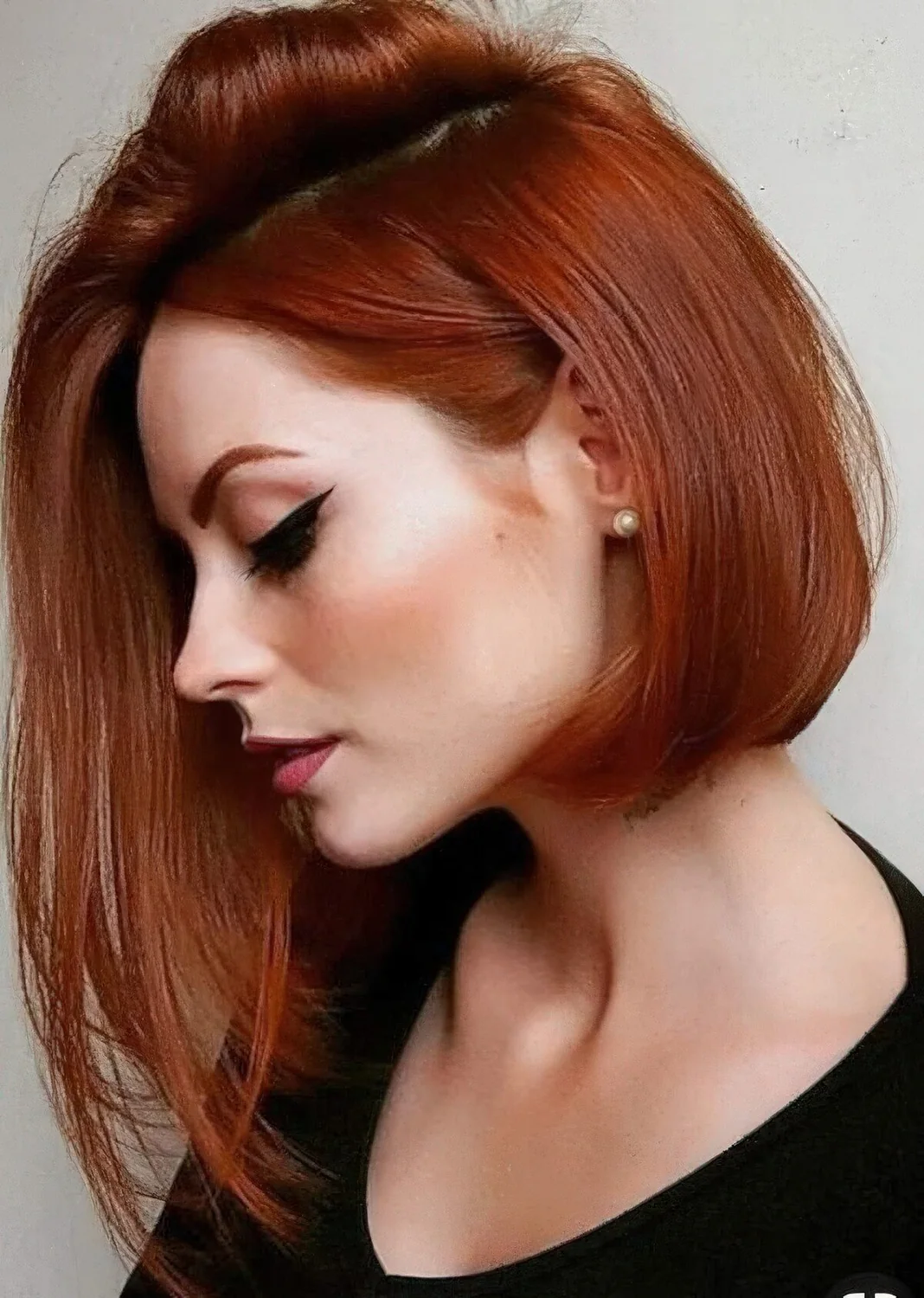 Photo showing asymmetrical bob hairstyle, with the hairstyle clearly visible.