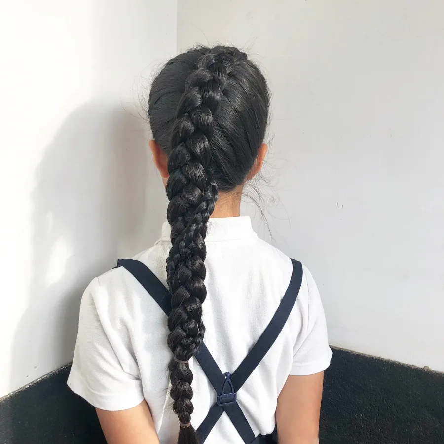 Back view of a simple long braid for a neat school hairstyle