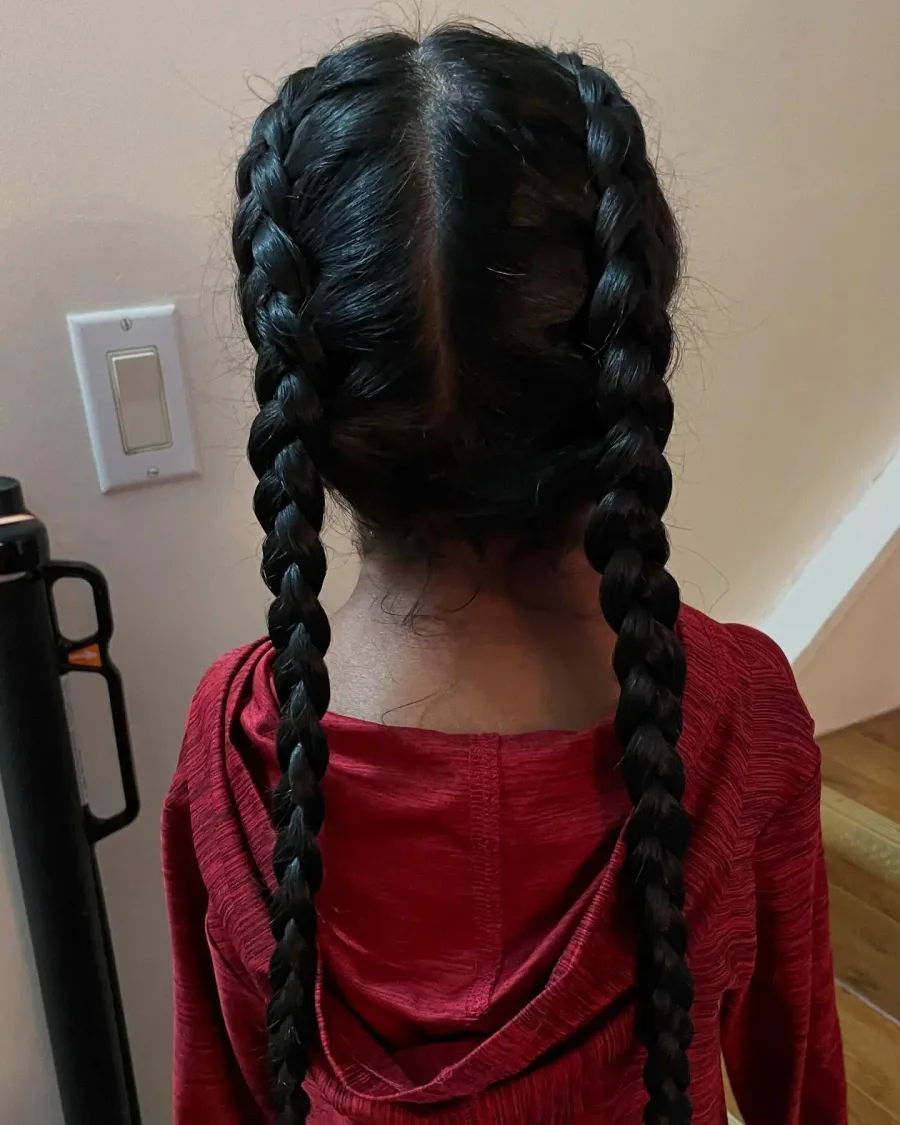 Back view of two long braids for thick hair on an active school day