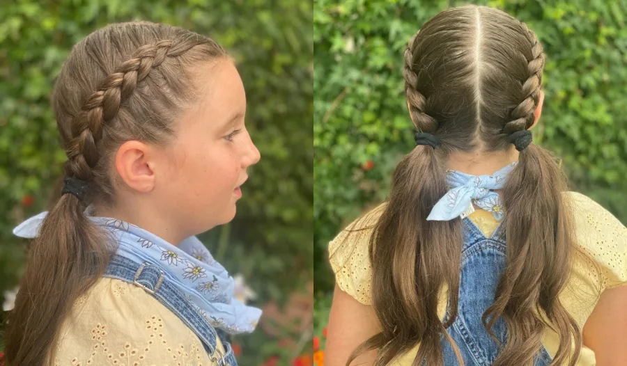Half-up school hairstyle with small braids and a bow accessory