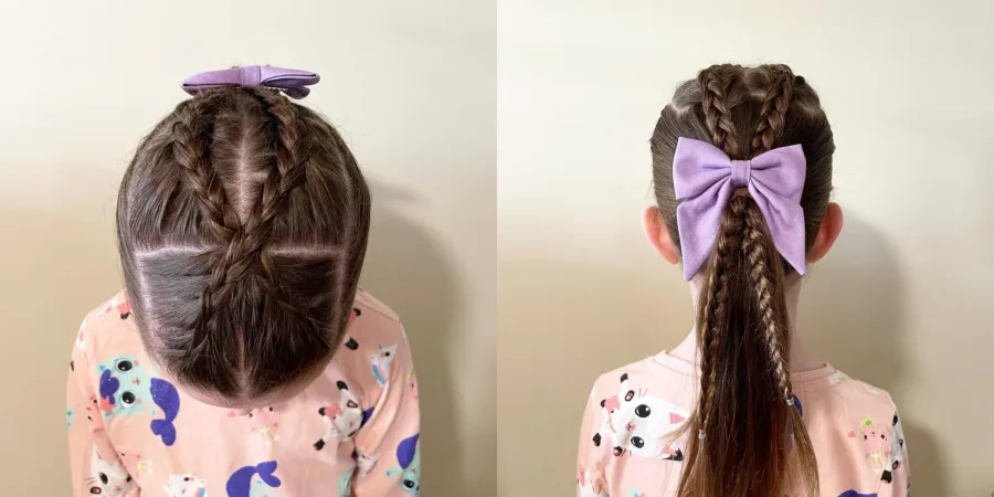 Low ponytail finished with a large bow for a school hairstyle