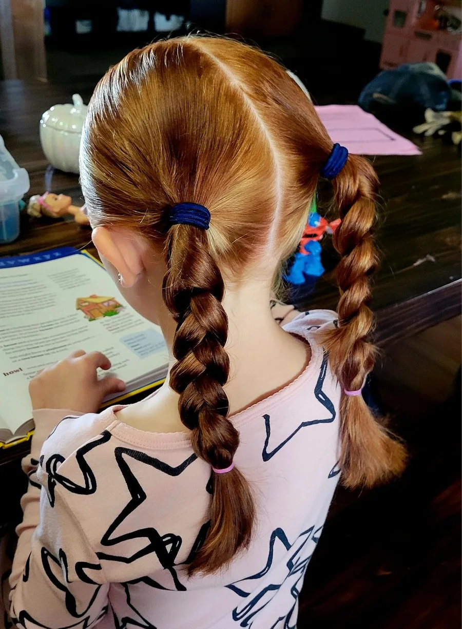 Sporty braided pigtails that keep hair secure for PE or recess