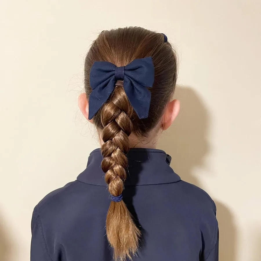 Classic center braid on long hair for a neat school look