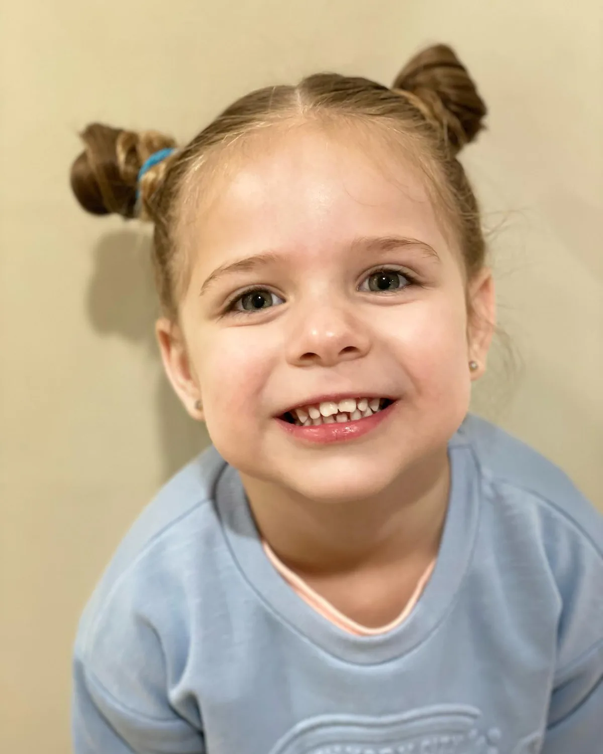 shoulder straight brunette bun shown as a school hairstyles idea, featuring shoulder outline
