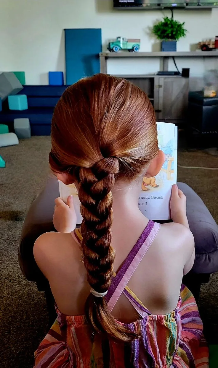 Braids with bright accent elastics for a colorful school hairstyle