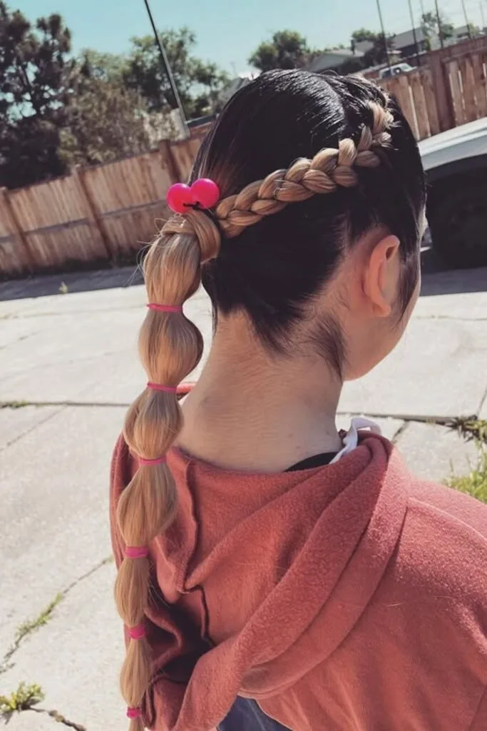 Side bubble braid pulled over the shoulder for school