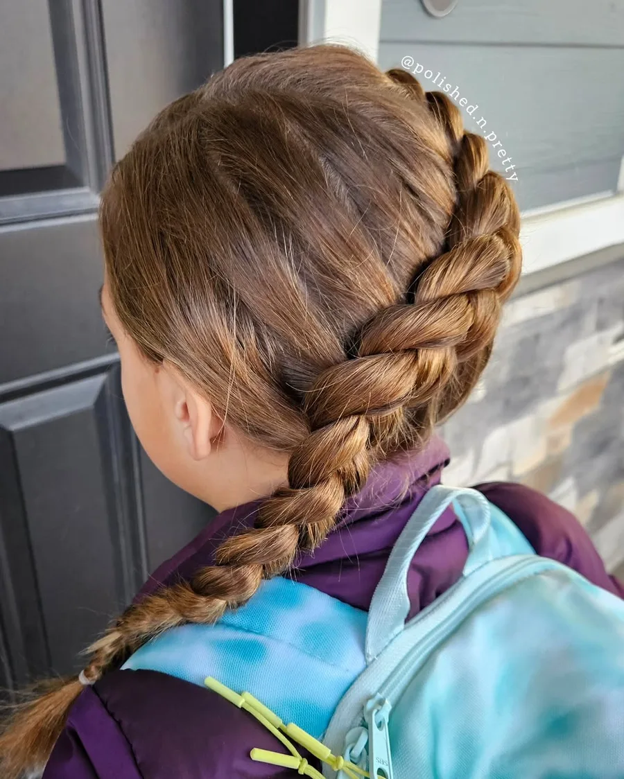 Side Dutch braid keeping front layers secure for school