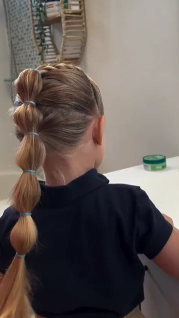 Low bubble ponytail tied gently for a school day
