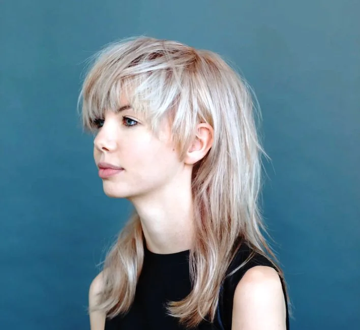 Bowl mullet, which has more shorter pieces at the front than a traditional mullet and lots of layers.