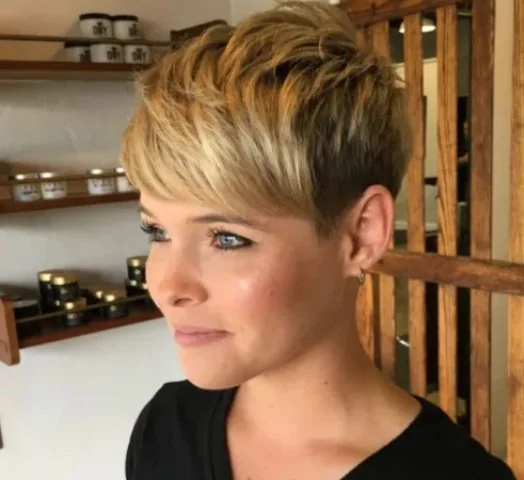 Photo showing pixie hairstyle, with the hairstyle clearly visible.