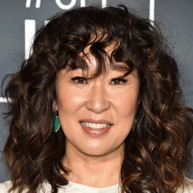 Sandra Oh's curly shag cut framing the face creates a great soft movement from the length of her bangs to the length of the hair.
