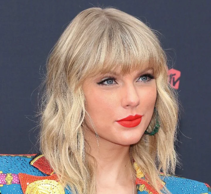 Taylor Swift puts a vintage spin on the long bob with long, textured layers guaranteed to lift any fine hair type.
