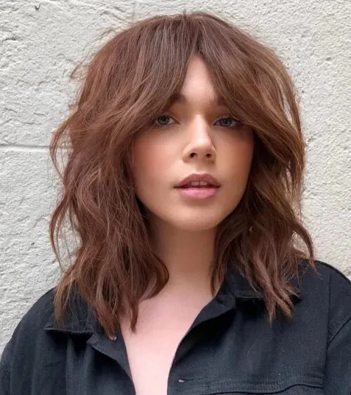 shoulder wavy chestnut shag with curtain fringe shown as a shag hairstyles for medium length thin fine hair idea, featuring shoulder outline