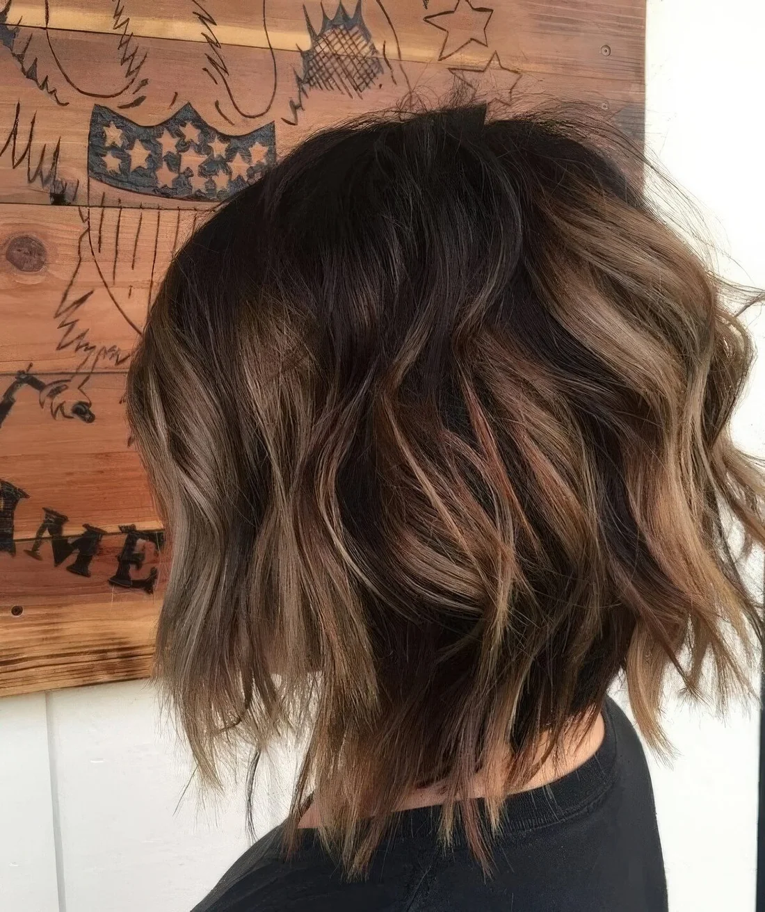 Razored layered bob with a darker root and caramel balayage.