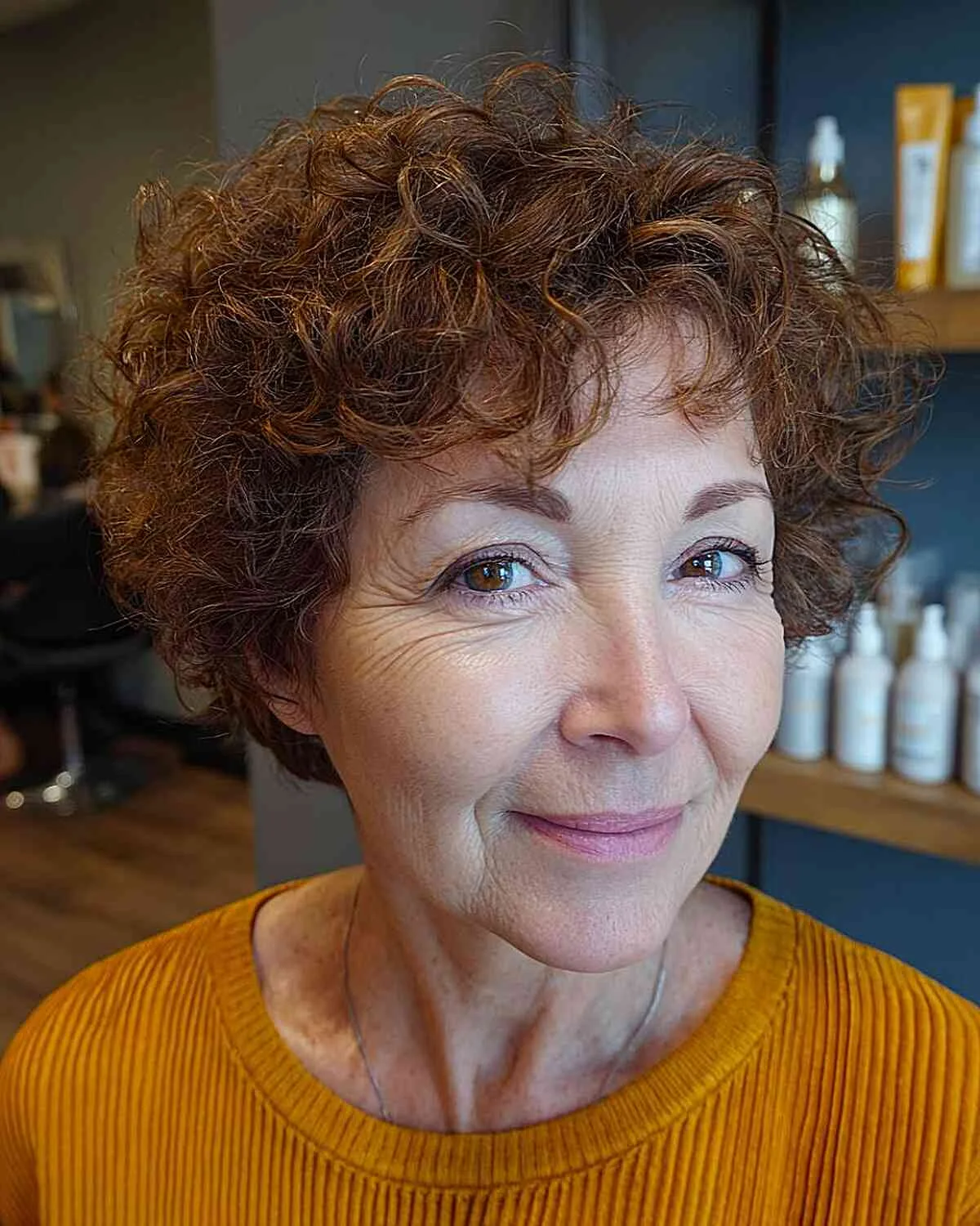 shoulder curly chestnut curly style with curly fringe fringe shown as a shaggy hairstyles for women over 50 idea