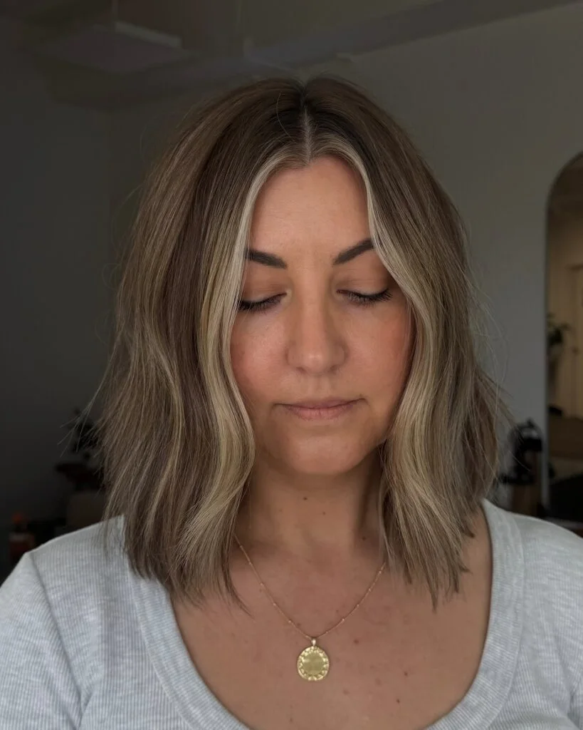 shoulder wavy blonde lob shown as a shaggy lob idea