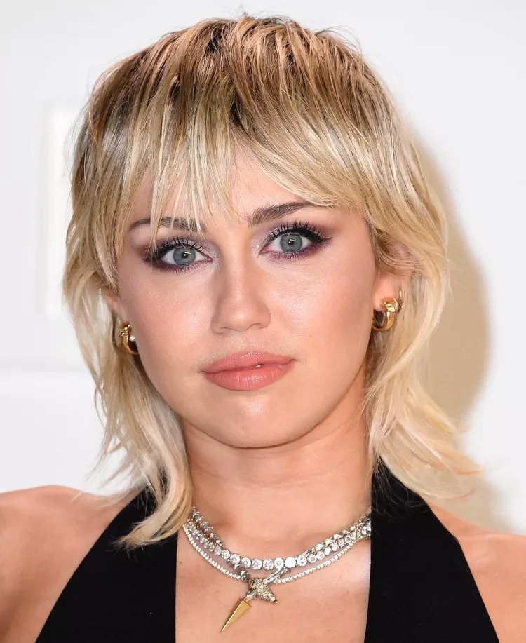 shoulder straight blonde shag with wispy fringe shown as a shaggy lob idea