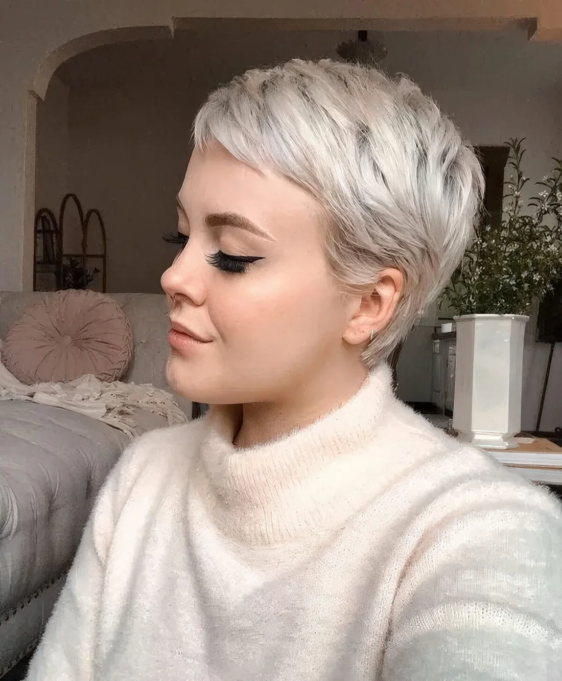 Long and layered platinum blonde pixie.