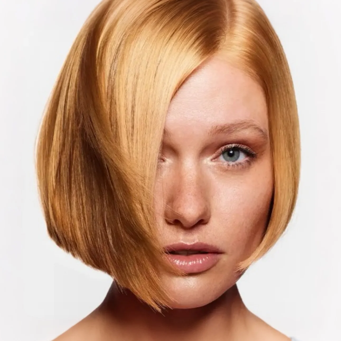 chin straight copper bob with side swept fringe shown as a short bob hairstyles for thin fine hair with a round face idea