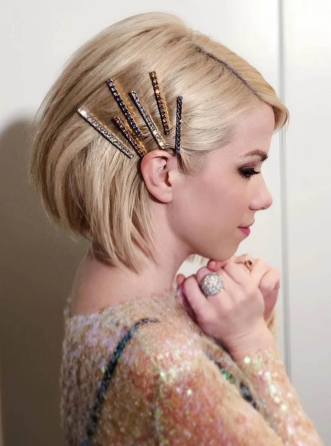 Photo showing gold rhinestone clips, with the hairstyle clearly visible.
