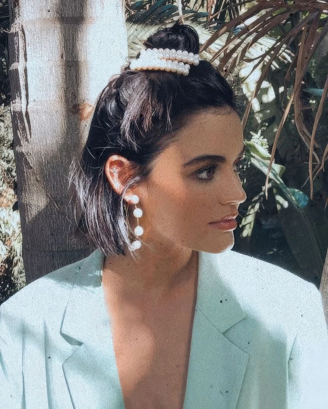 Photo showing half-up pearl clips, with the hairstyle clearly visible.