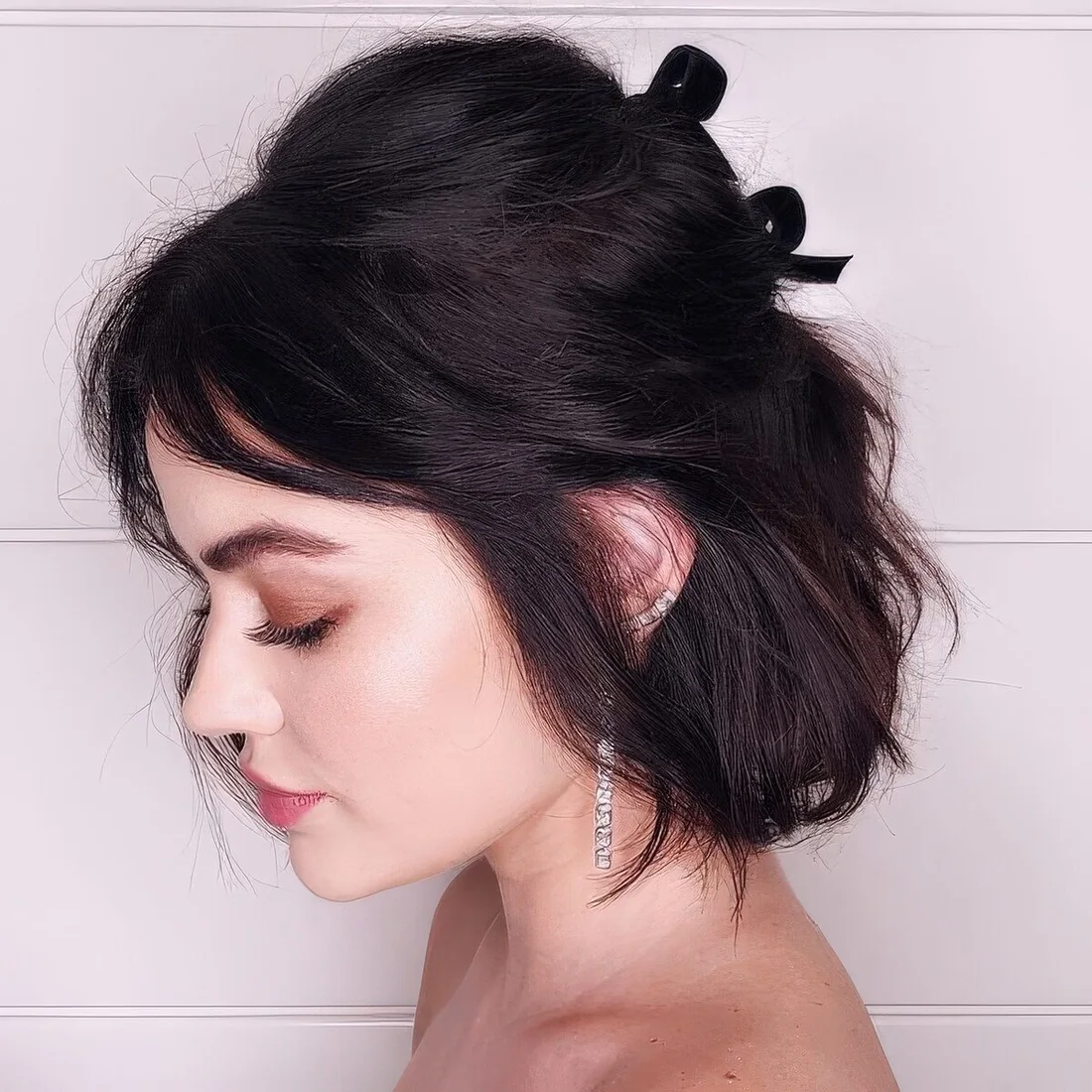 Photo showing half-up two bows, with the hairstyle clearly visible.