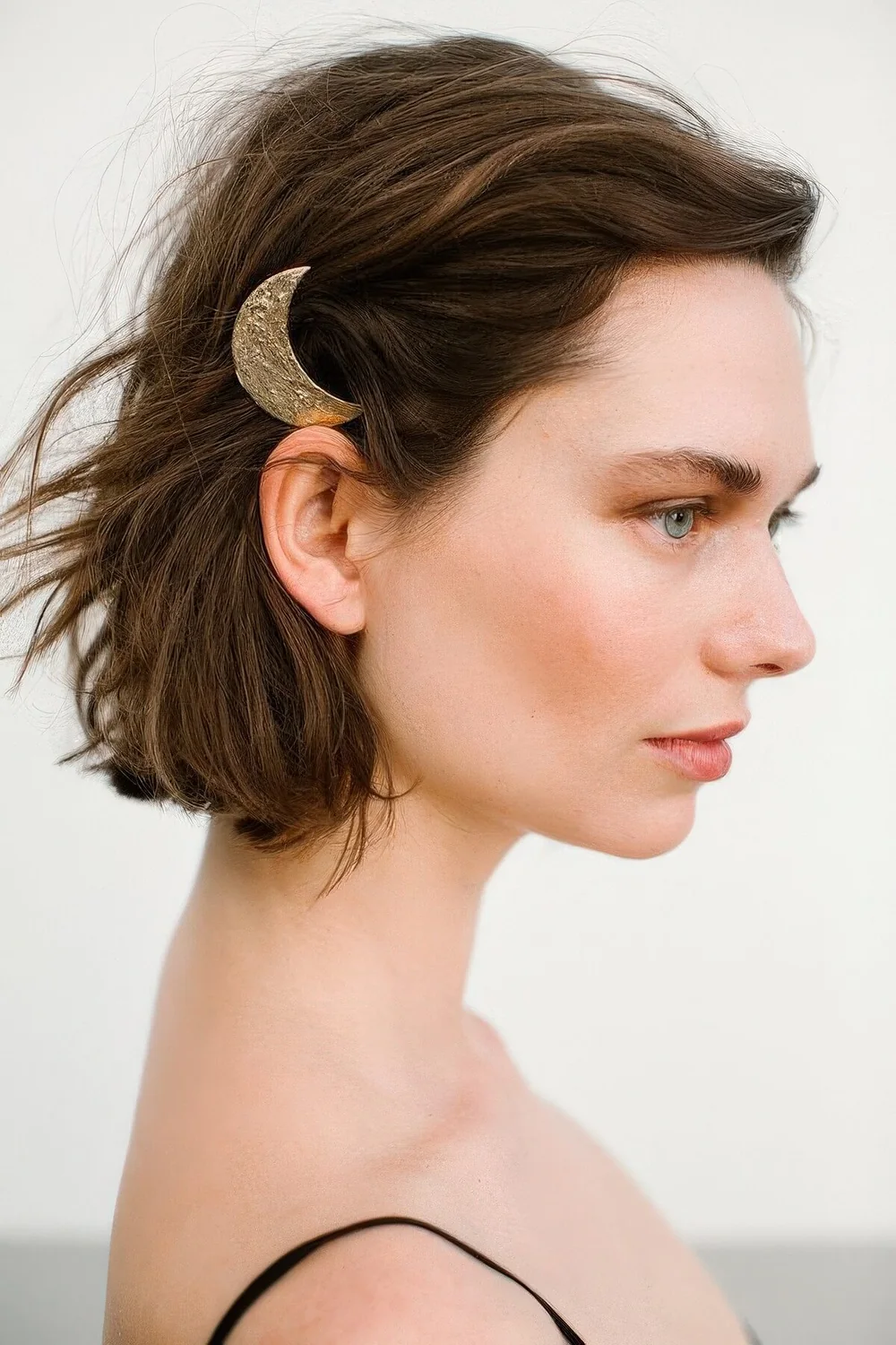 Photo showing moon hair pin, with the hairstyle clearly visible.