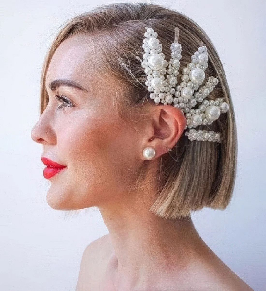 Photo showing statement pearl clips, with the hairstyle clearly visible.