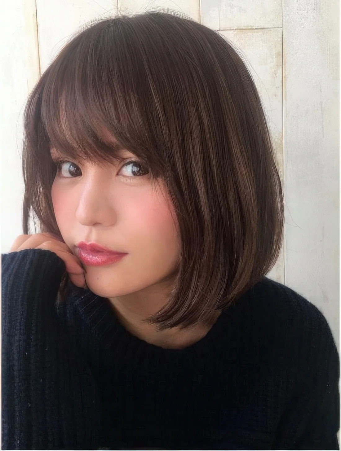 Photo showing brown bob fringe, with the hairstyle clearly visible.