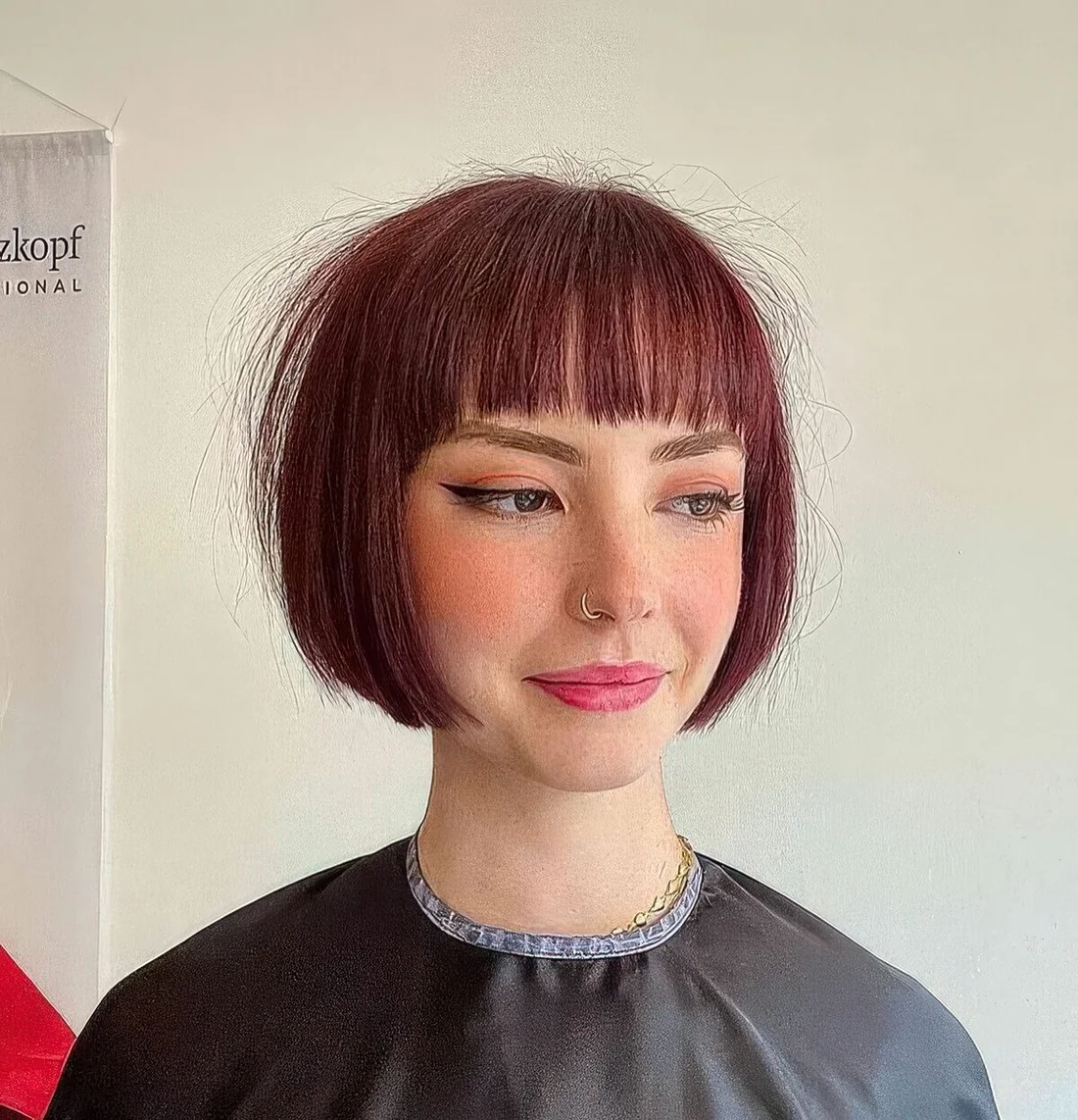 Photo showing cherry red bob, with the hairstyle clearly visible.