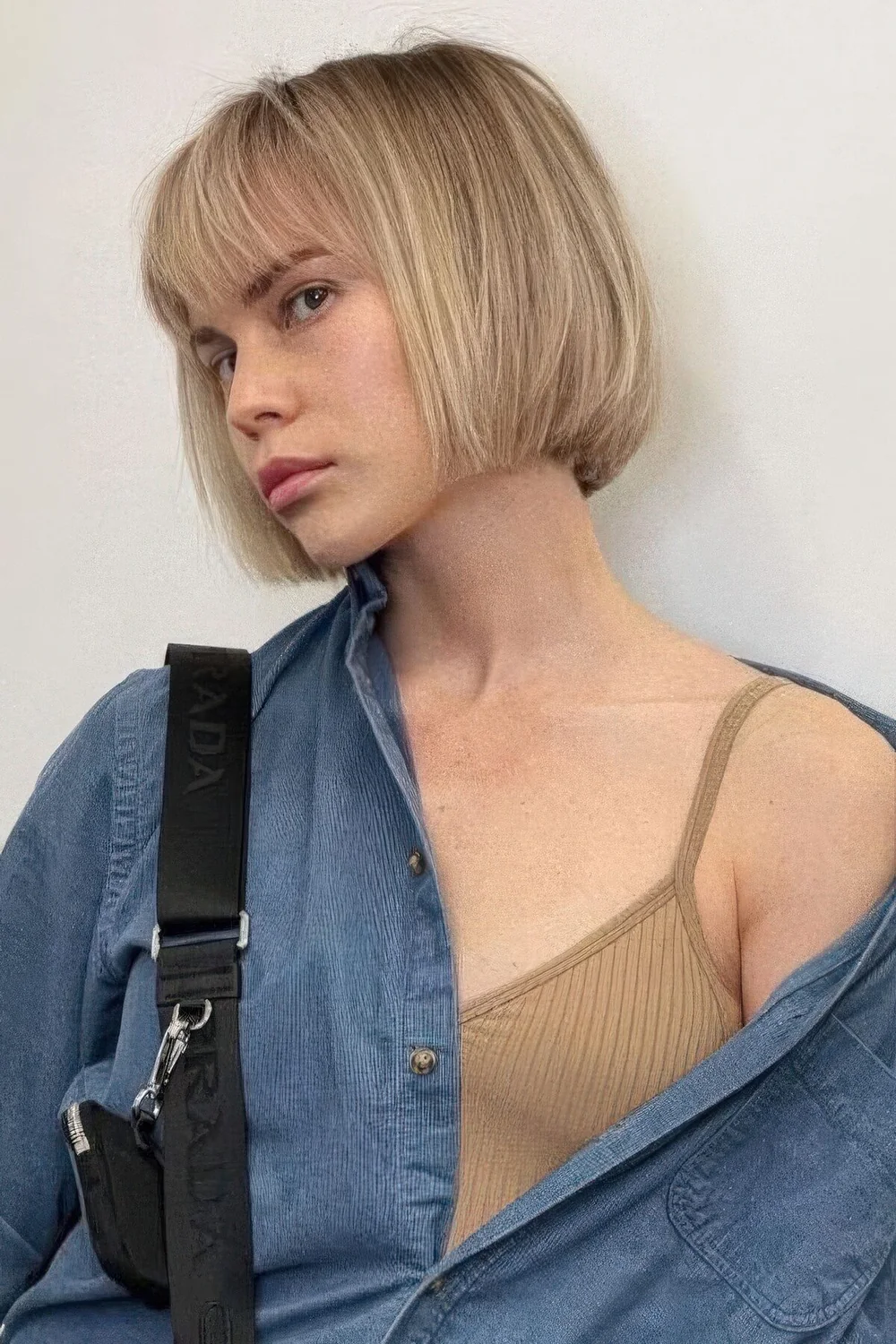 Photo showing lip line blonde bob, with the hairstyle clearly visible.