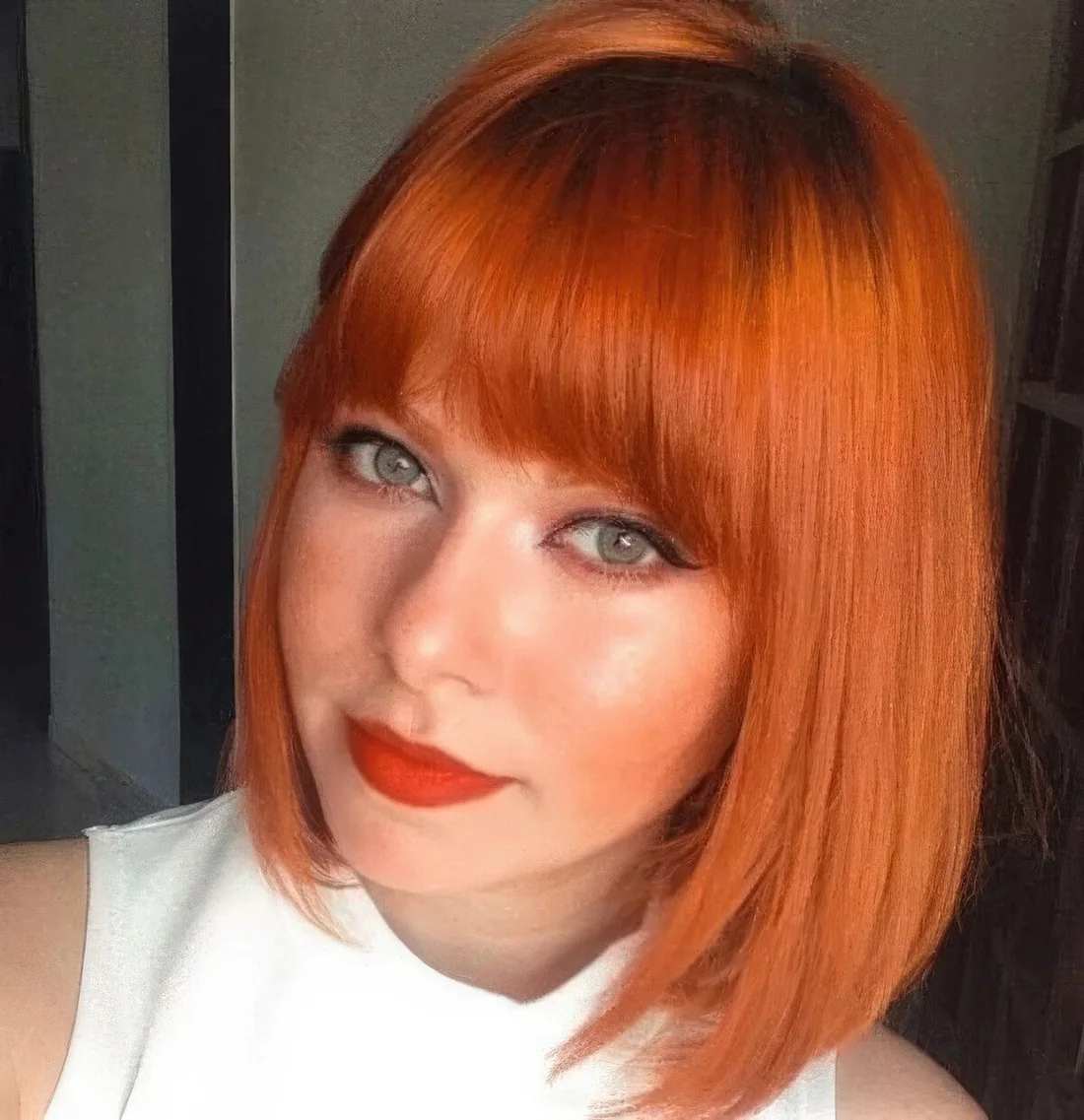 Photo showing orange bob fringe, with the hairstyle clearly visible.