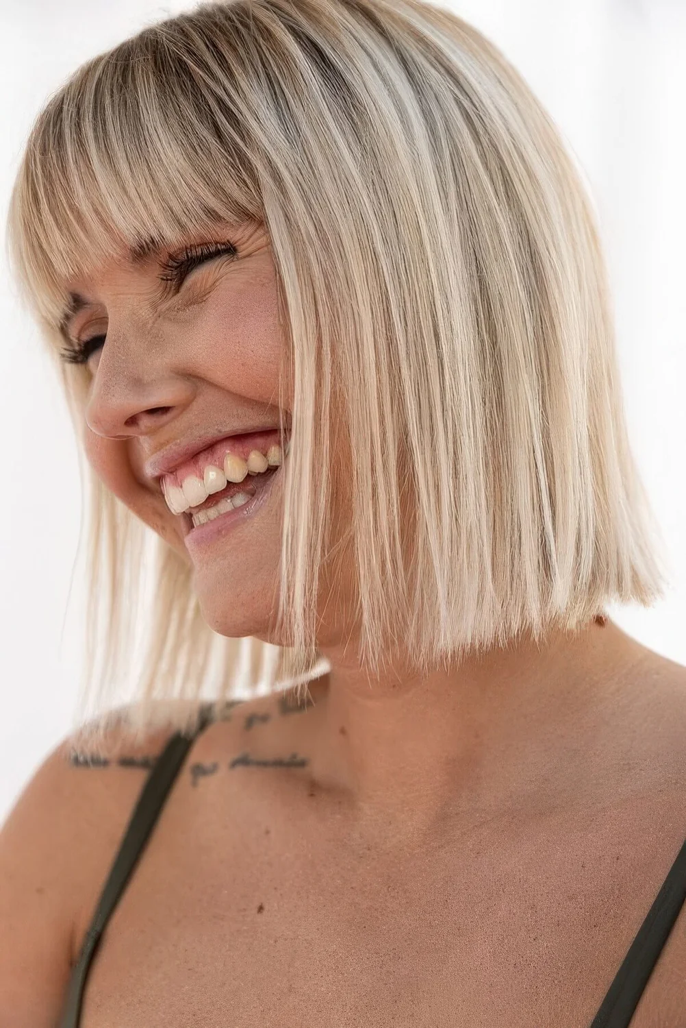 Photo showing straight blonde bob, with the hairstyle clearly visible.