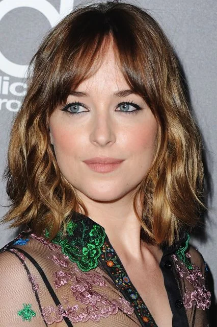 medium wavy caramel shag with curtain fringe shown as a short butterfly haircuts idea