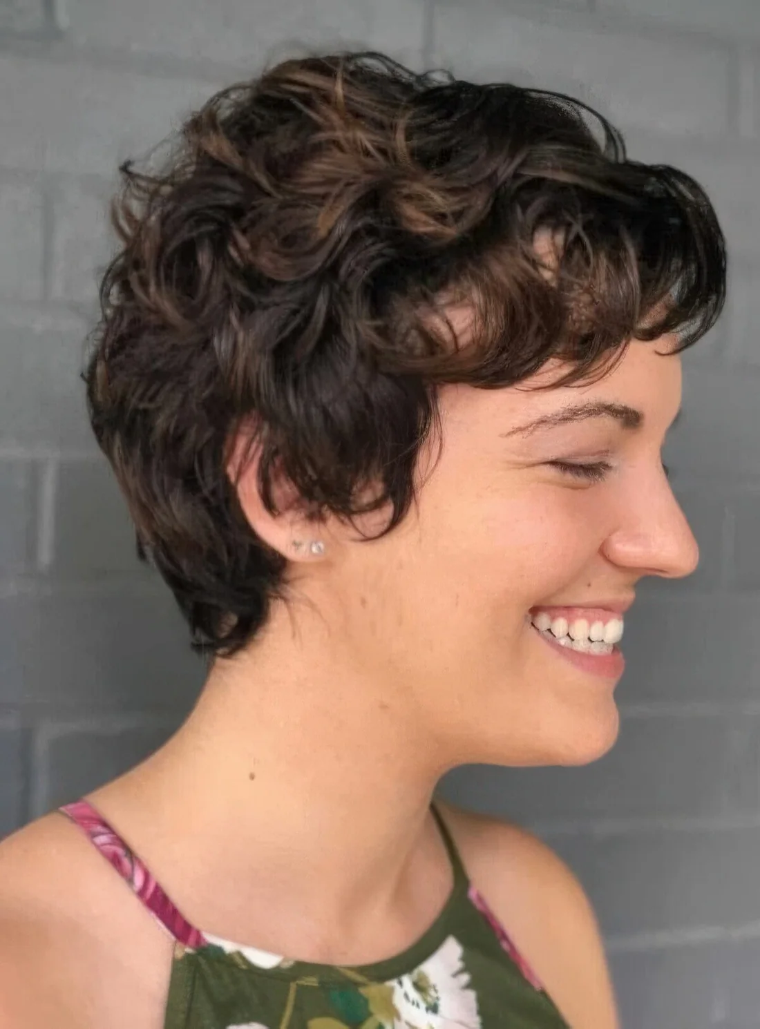 Wavy pixie with softness around the ears.