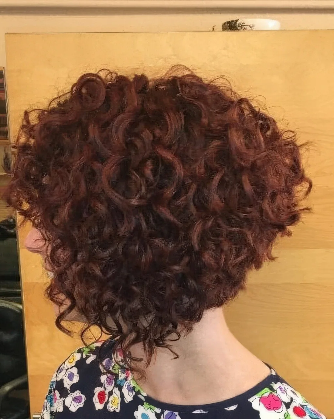 Photo showing dark ginger A line bob, with the hairstyle clearly visible.