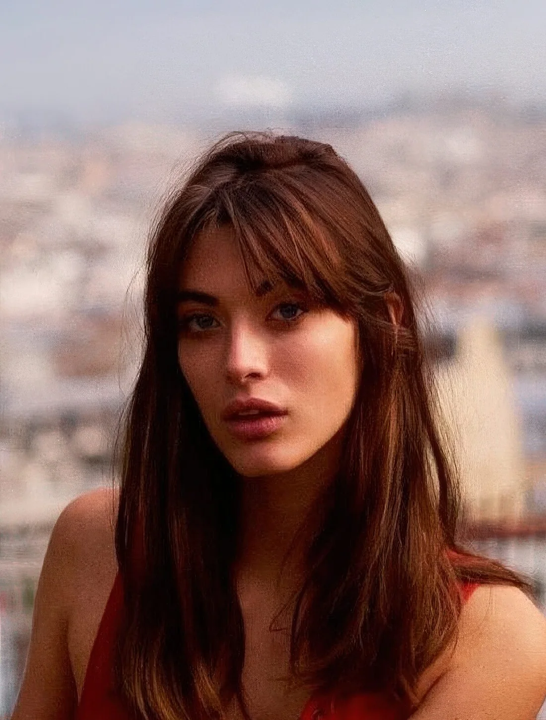 Long dark hair with curtain bangs and texture.
