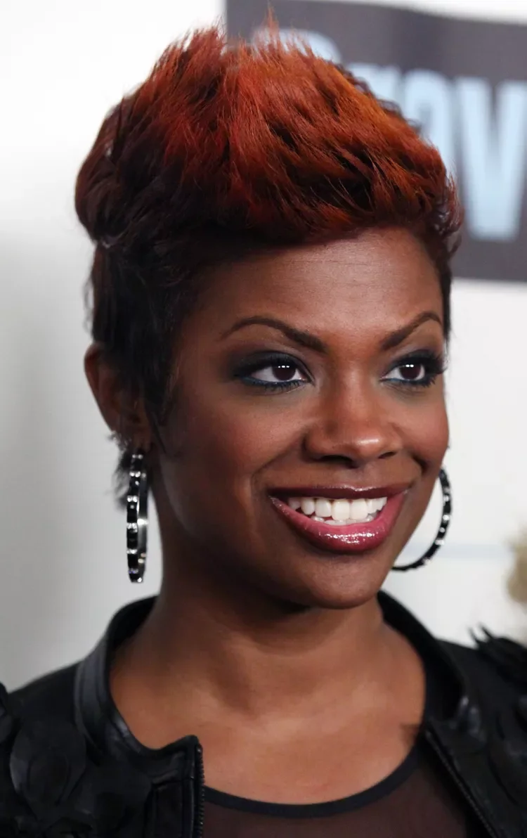 ear straight auburn pixie with side swept fringe shown as a short fine hairstyles for women in their 40s idea