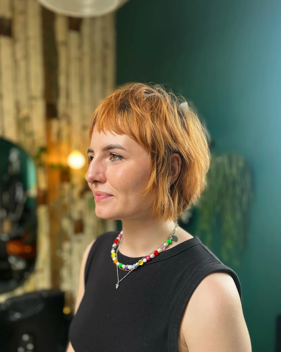 neck wavy copper shag with micro fringe shown as a short fine hairstyles for women in their 40s idea