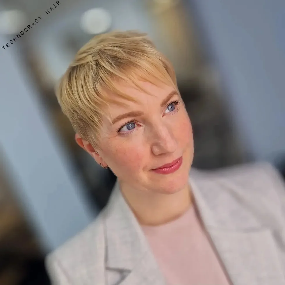 ear straight golden pixie with wispy fringe shown as a short fine hairstyles for women in their 40s idea