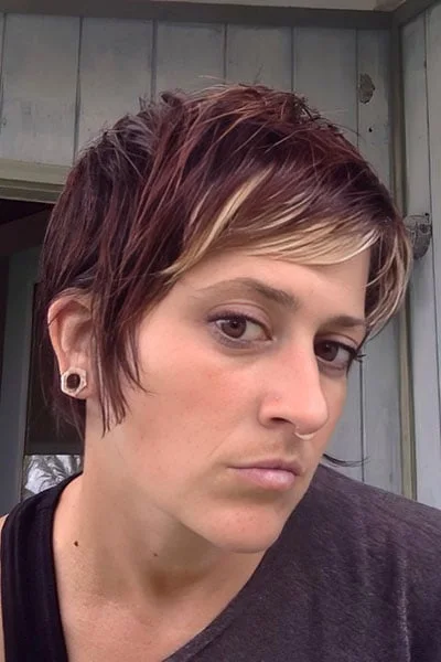 ear straight chestnut pixie with side swept fringe shown as a short fine hairstyles for women in their 40s idea, featuring volume through the crown