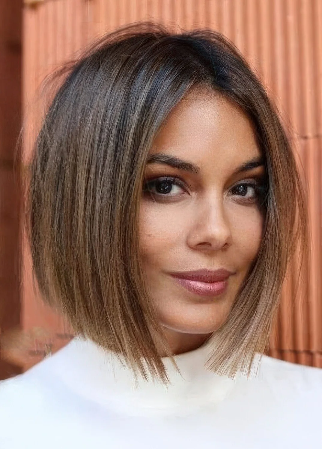 Dark brown short bob with bronde balayage to make the look more eye catchy and bold.