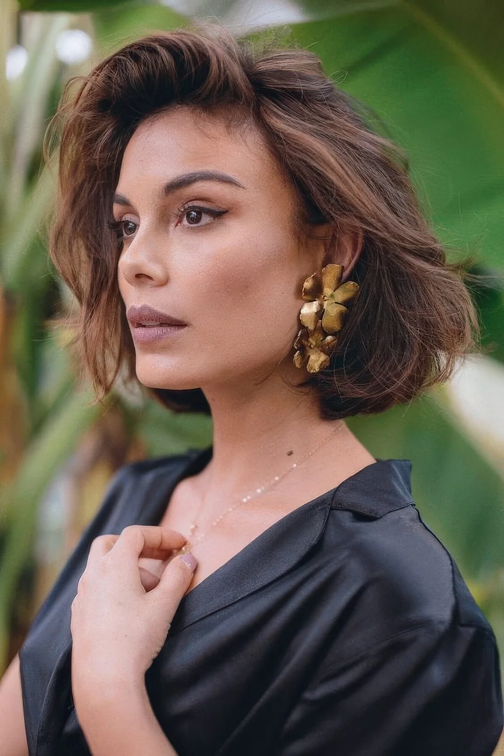 Dark brown, almost black bob with caramel and brown balayage, with messy waves and texture.