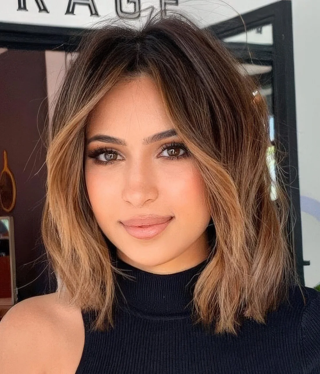 Killer brown bob with caramel balayage and a money piece to highlight the face.