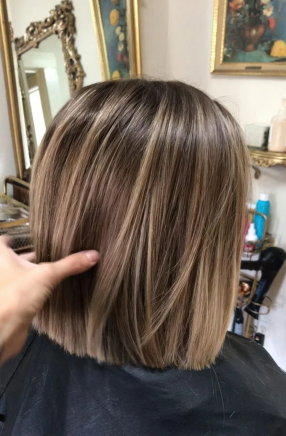 Light brown bob with blonde balayage that.