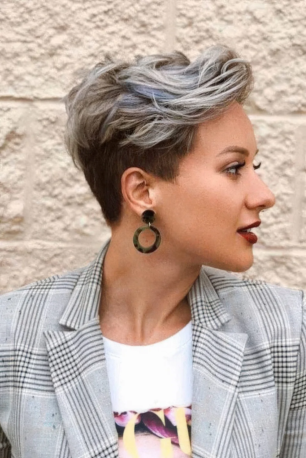 Long pixie with blonde balayage, with waves and a bit of texture.