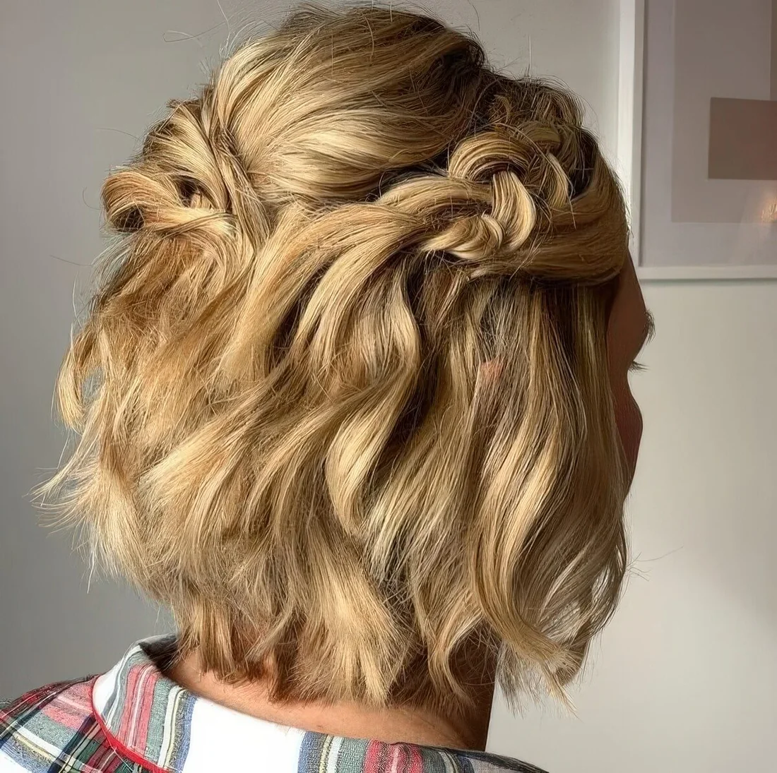 Photo showing medium-length blonde bob, with the hairstyle clearly visible.
