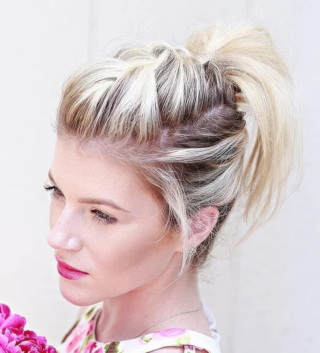 Photo showing high messy ponytail, with the hairstyle clearly visible.